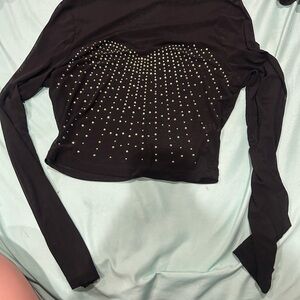 Elegant Black Long Sleeve Top with Gold Accents